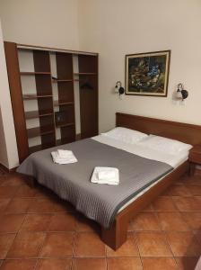 Postel nebo postele na pokoji v ubytování Garni Hotel Meduza + 37 fotografií