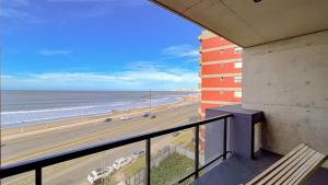 a balcony with a view of the ocean and a beach at Semi piso 3 ambientes con vista plena al mar en Constitución in Mar del Plata
