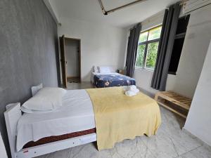 Postel nebo postele na pokoji v ubytování Nomads Hostel Multicultural & Coworking