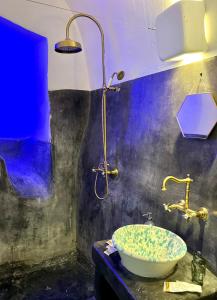 a bathroom with a sink and a shower at Casa Lina in Ostuni