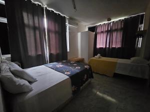 Postel nebo postele na pokoji v ubytování Nomads Hostel Multicultural & Coworking