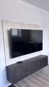 a large flat screen tv on a wall at 3 Bedroom House Near City Centre Glasgow Sleeps 7 in Glasgow