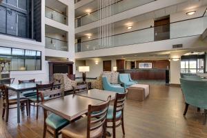 a lobby of a hospital with tables and chairs at Drury Inn & Suites Cape Girardeau in Cape Girardeau