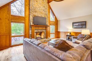 a living room with a couch and a fireplace at Large Dahlonega Home, Ideal for Family Gatherings! in Dahlonega
