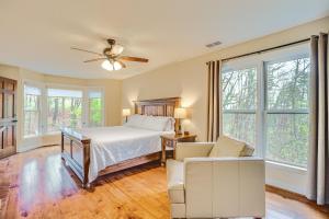 a bedroom with a bed and a couch at Large Dahlonega Home, Ideal for Family Gatherings! in Dahlonega