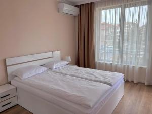 Postel nebo postele na pokoji v ubytování Апартаменти Bella Deluxe