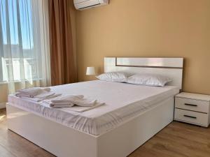 Postel nebo postele na pokoji v ubytování Апартаменти Bella Deluxe