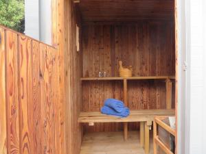 a sauna with a blue towel sitting on a bench at Mount Pleasant Views in Christchurch