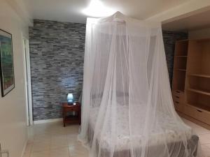 Postel nebo postele na pokoji v ubytování Appartement sable blanc r a i a