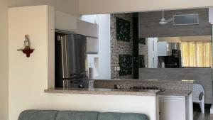 Kuchyň nebo kuchyňský kout v ubytování Casa en condominio + 15 fotografií
