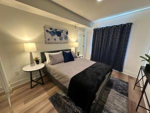 a bedroom with a bed and a table and a window at The Century City Cozy 3 Bedroom Apartment with free parking! in Los Angeles