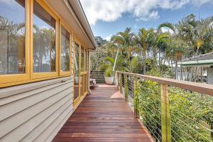 a porch of a house with a wooden walkway at Las Palmas in Gold Coast