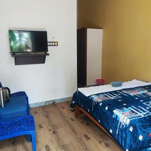 Postel nebo postele na pokoji v ubytování Maha Periyava Kuteeram