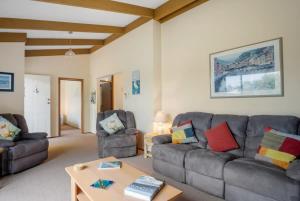 a living room with two couches and a coffee table at Cave Street Retreat - 38 Cave Street Goolwa Beach - BYO Linen in Goolwa South