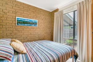 Knights View - 2 14 Merrilli - BYO Linen - Wi-Fi - Beachfront客房内的一张或多张床位