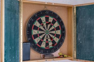 a dart board in a classroom with a chalkboard at Encounter Bay Family Escape, Sea Views, Games Room & Walk to The Bluff in Encounter Bay +34 photos