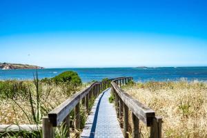 a wooden boardwalk leading to the beach at 4 1 Harbour View Terrace BYO Linen in Victor Harbor