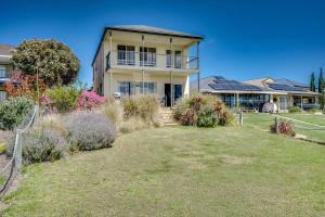 a large house with a yard in front of it at T2 12 Wentworth Pde Hindmarsh Island - No Linen Included in Hindmarsh Island