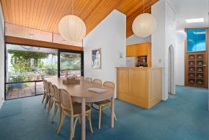 a kitchen and dining room with a wooden table and chairs at Casa Blanca - 2-4 Heggerton St McCracken - No Linen Included in McCracken