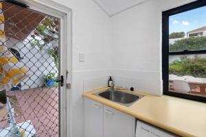 a kitchen with a sink and a window at Casa Blanca - 2-4 Heggerton St McCracken - No Linen Included in McCracken +33 photos