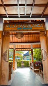 a lobby of a resort with a sign on it at Villa Casablanca Surf Keramas in Keramas