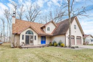 a white house with a brown roof at Housepitality - The Indian Lake Escape - 4 BR in Huntsville