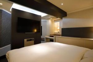 Letto o letti in una camera di ホテルロイヤルトン
