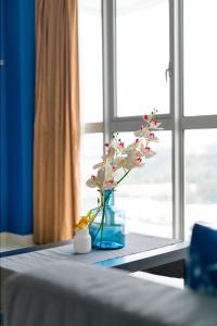 The Art of Vermeer Blue with Blooming Orchids