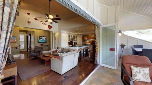a living room with a couch and a table at C300 Custom 4 bedroom Ocean View Penthouse in Koloa