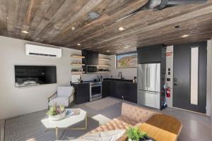 a living room with a couch and a kitchen at Zion loft with canyon views - unit 2 in Springdale