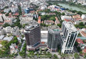 an aerial view of a city with tall buildings at Melia Hanoi in Hanoi