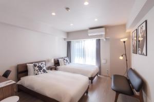 Letto o letti in una camera di LANG Hotel Kameido-2#Near Akihabara#チェックアウトのみ清掃あり