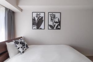 Letto o letti in una camera di LANG Hotel Kameido-2#Near Akihabara#チェックアウトのみ清掃あり