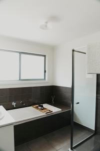 a bathroom with a sink and a window at Spacious Stay On Shamrock, Bendigo in Golden Square