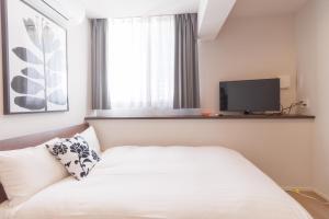 Letto o letti in una camera di LANG Hotel Kameido-2#Near Akihabara#チェックアウトのみ清掃あり