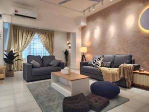 a living room with two couches and a table at New!14pax,Petaling Jaya Damansara Landed Home next Starling Atria Mall 1U IKEA in Petaling Jaya