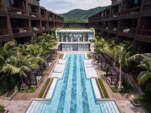 an aerial view of a hotel with a swimming pool at Luxury King Bed Apartment with Pool View and Sauna, Spacious 57 sqm, in Rawai Beach