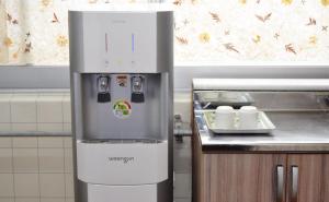 a refrigerator in a kitchen next to a counter at Maru 1000 years in Jeonju