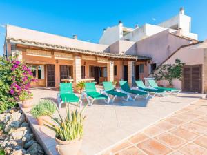 a group of chairs sitting on a patio at Buenos Aires - Villa With Private Pool In Manacor Free Wifi in Manacor