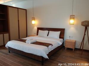 Voodi või voodid majutusasutuse Ream YoHo Resort toas