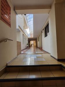 an empty hallway of a building with a skylight at Hotel Brasil in Antofagasta