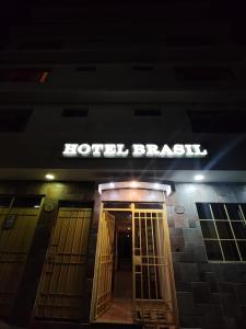 a hotel block with a sign above a door at Hotel Brasil in Antofagasta