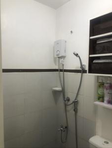 a shower stall in a bathroom with a shower at Z House of Guest- Airport Davao in Davao City