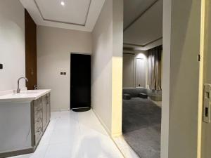 a bathroom with a sink and a toilet in a room at شاليه جود in Riyadh
