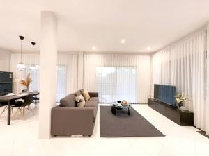 a living room with a couch and a table at Prime Hill , Kathu Phuket / F3 in Phuket Town