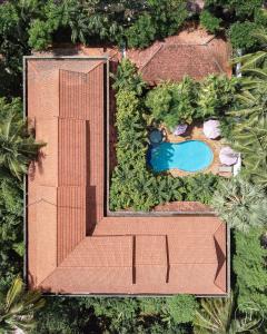 an overhead view of a house with a swimming pool at Pavillon Indochine Boutique - Hotel in Siem Reap