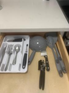 a drawer full of kitchen utensils on a counter at The Cove Downtown in Sacramento