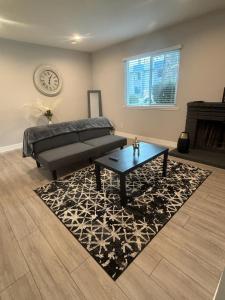 a living room with a bed and a coffee table at The Cove Downtown in Sacramento