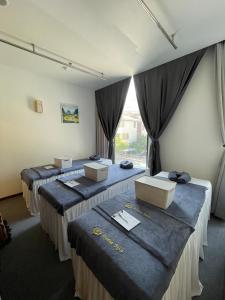 Voodi või voodid majutusasutuse Danaciti Hotel toas