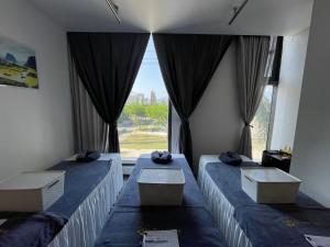 Voodi või voodid majutusasutuse Danaciti Hotel toas